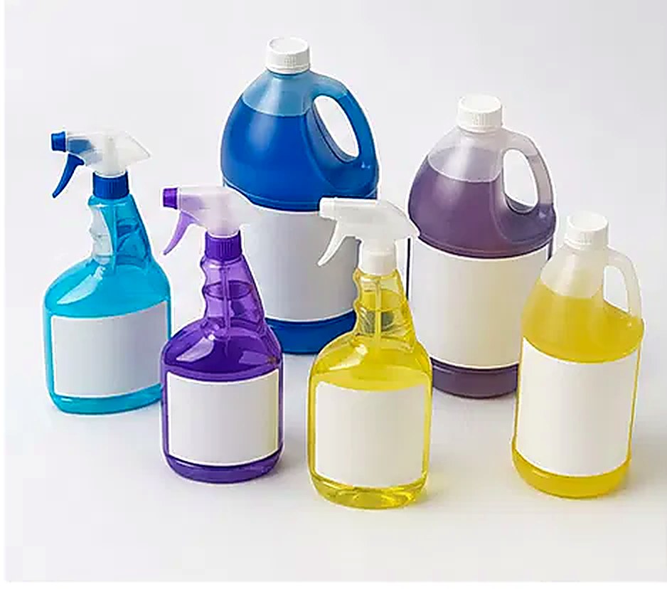 Spray bottles and jugs of cleaning solution